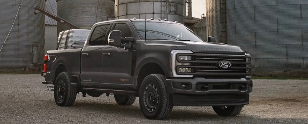 A gray Ford F-250 Super Duty truck parked at a work site