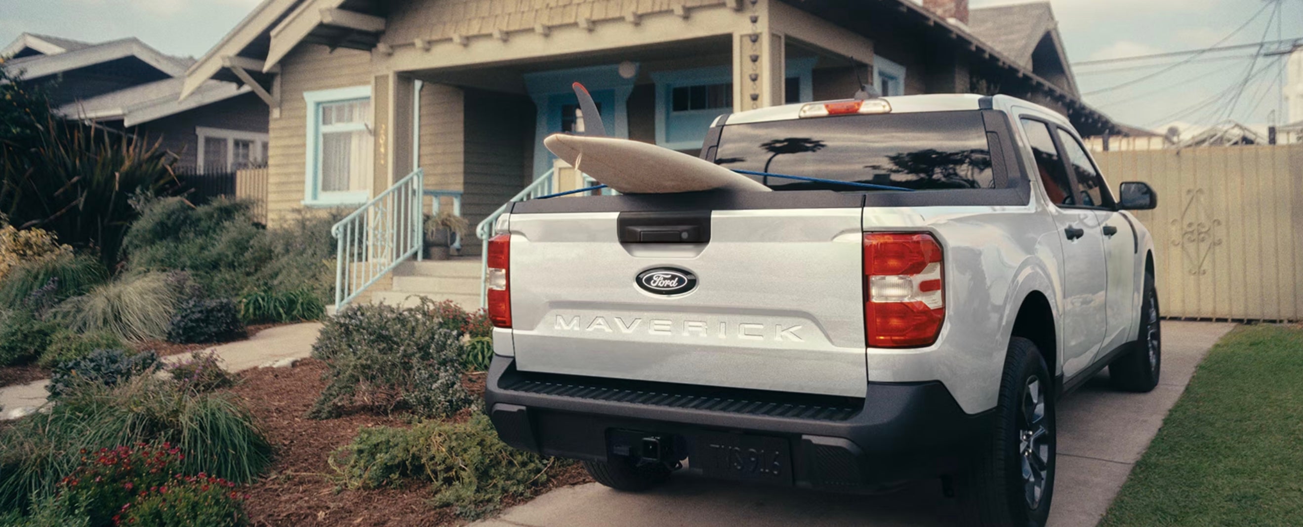 A white 2026 Ford Maverick truck parked in a driveway